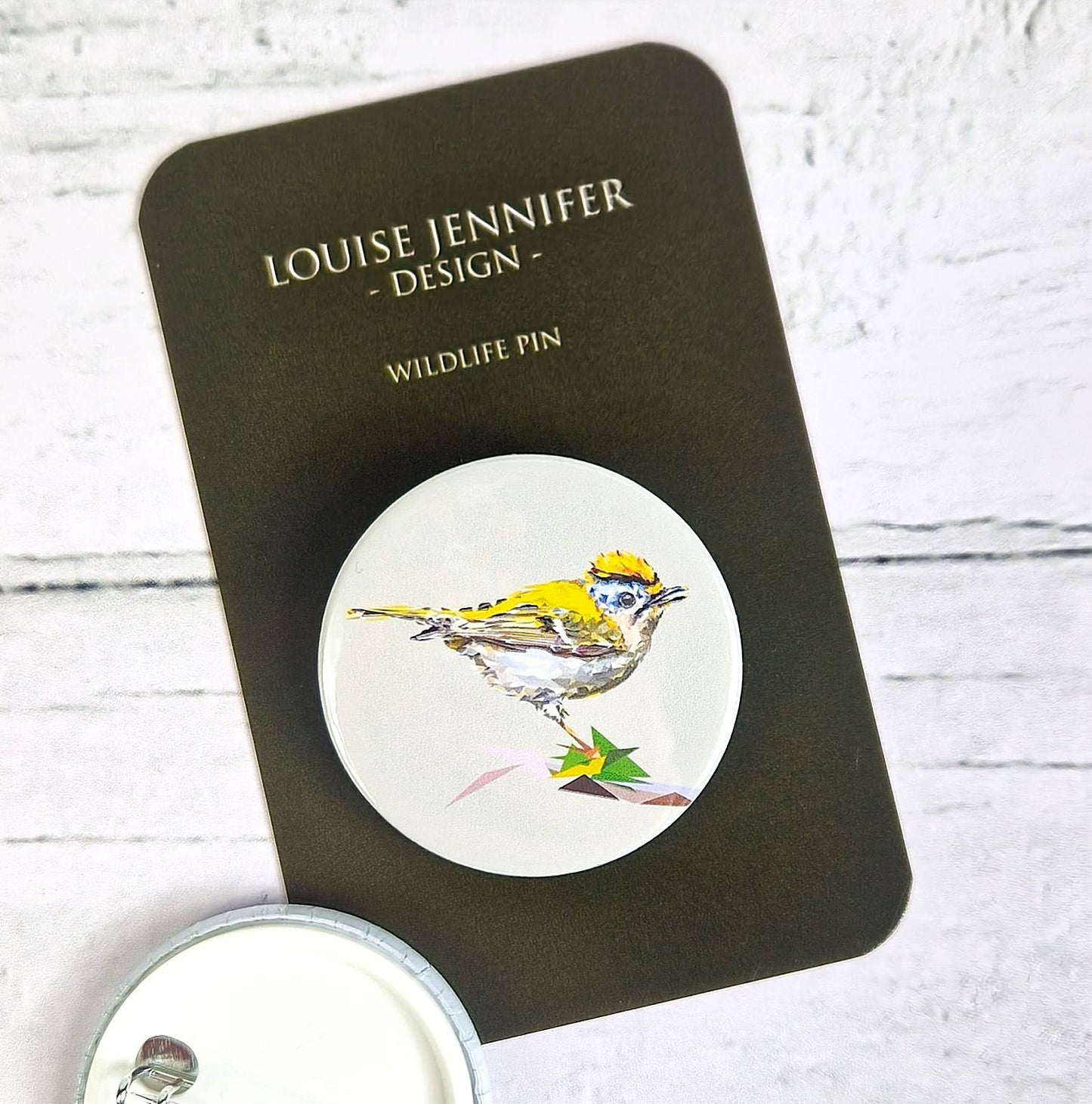 GOLDCREST pin badge
